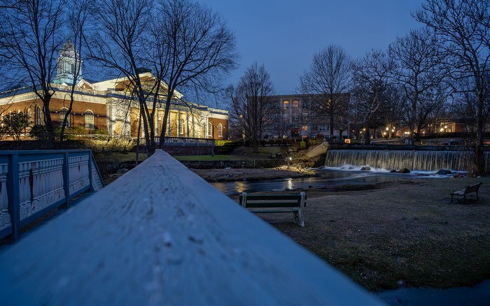 Building and waterfall at dusk