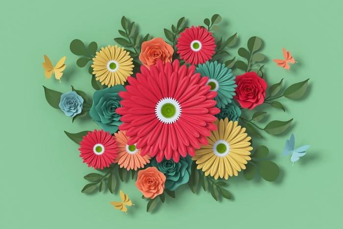 Paper flowers and butterflies on green background