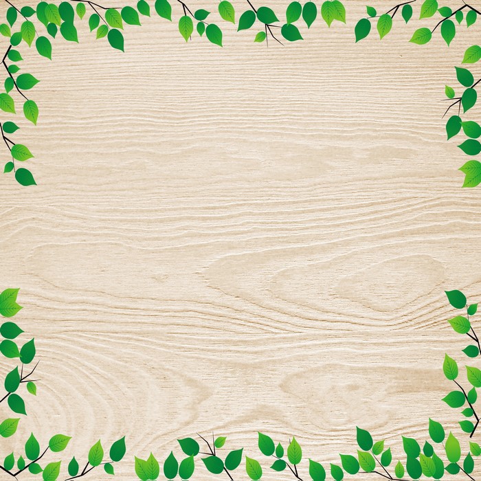 Green leaves border on a wooden background