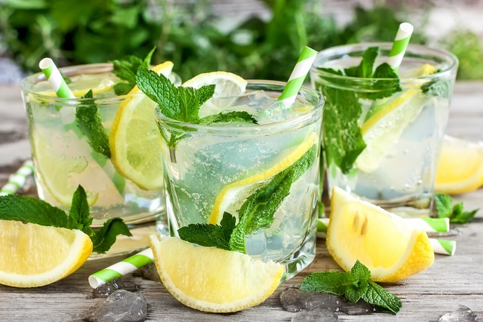 Refreshing Mojito drinks with lemon and mint