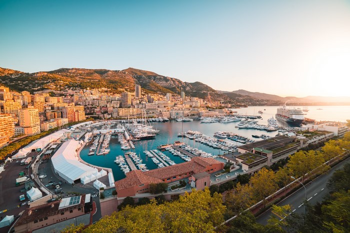Monaco Marina with Yachts and Cruise Ship at Sunset
