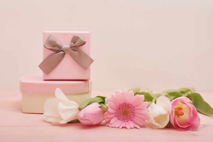 Pink gift boxes with bow and flowers