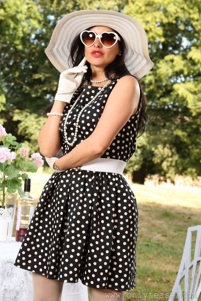 Cassie Clarke in polka dot dress and hat