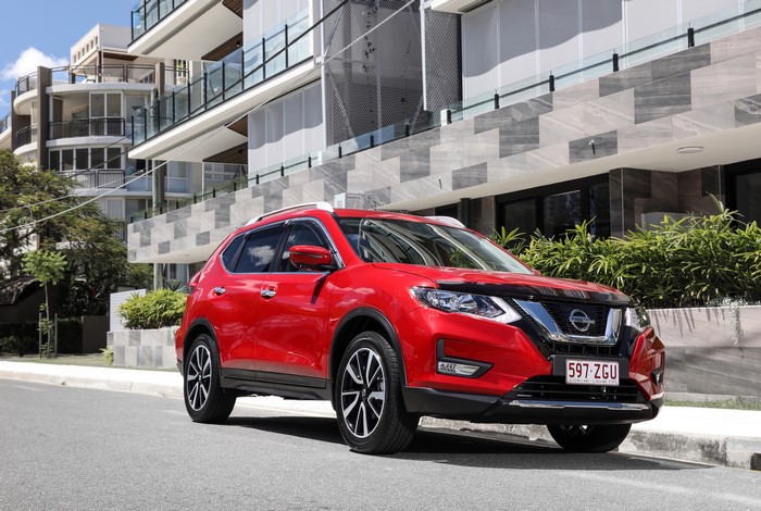 Red Nissan X-Trail N-Trek parked on street
