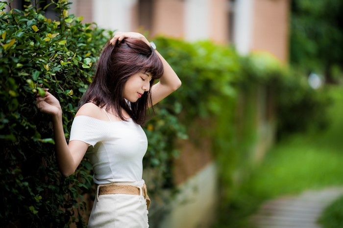 4K Asian Woman with Brown Hair in Bokeh Pose