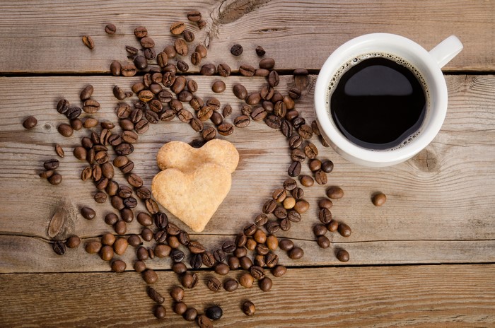 Coffee and Heart-Shaped Cookies on Wood
