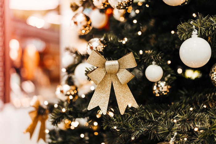 Christmas tree with gold bow and ornaments
