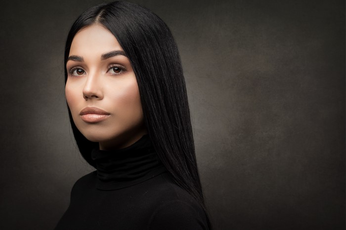Brenda, a brunette woman with makeup
