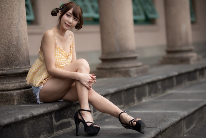 4K Asian Woman Sitting on Stone Steps