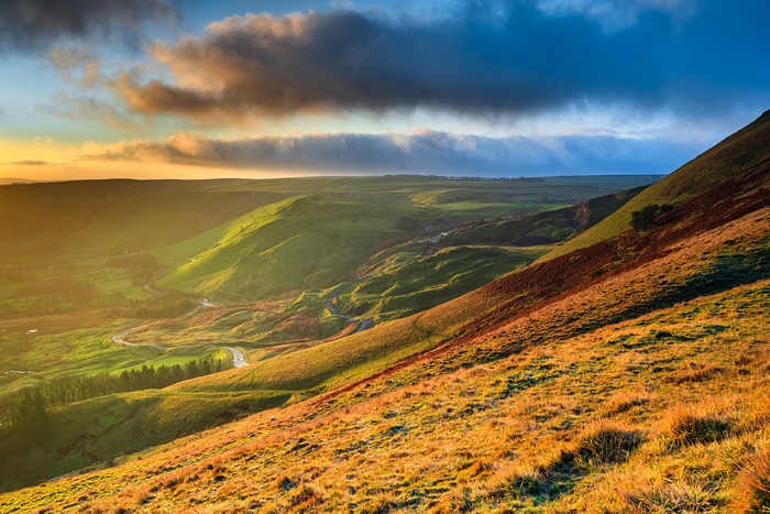 Rolling green hills in England at sunset