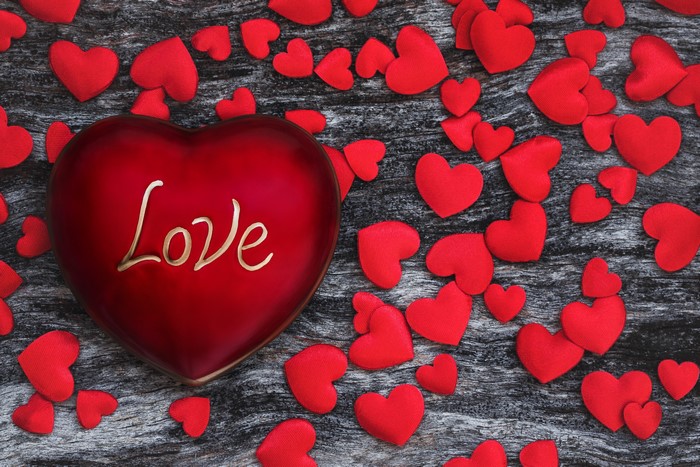 Red heart with "Love" text and scattered red hearts