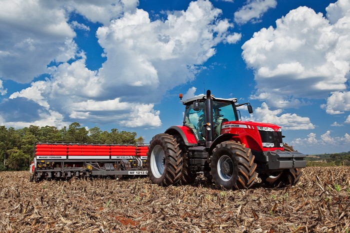 Massey Ferguson tractor with planter in a field