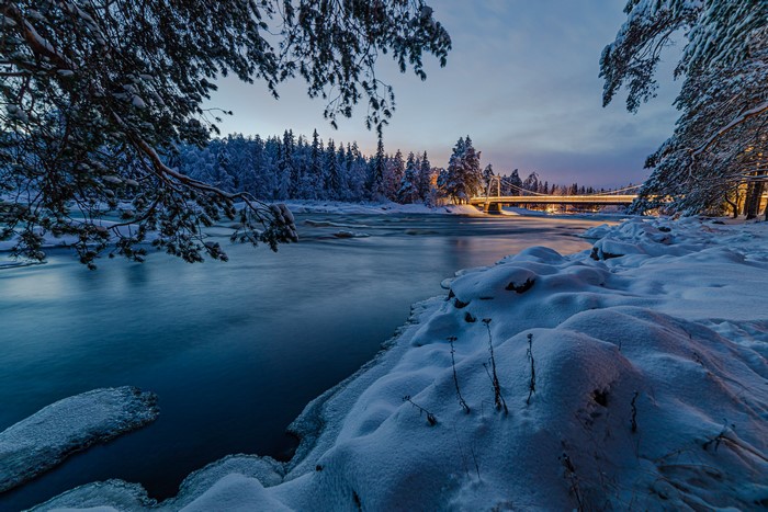 Winter River and Bridge in Oulu, Finland