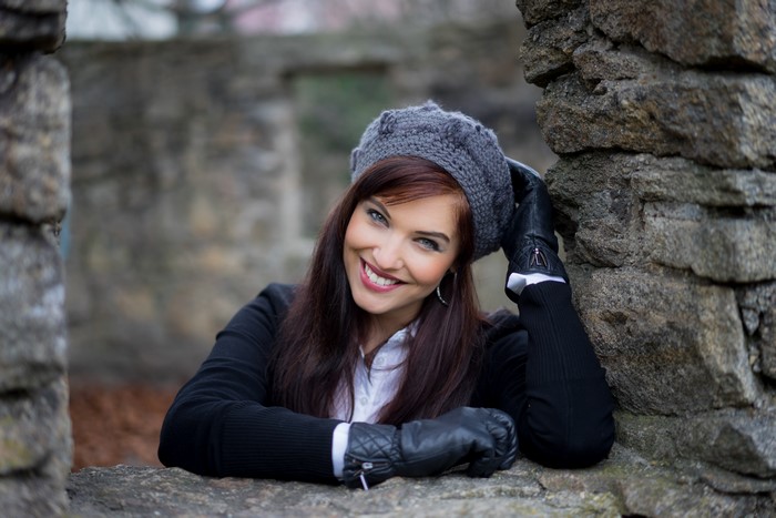 Sandra wearing a beret and gloves