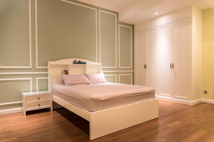 Bedroom with bed, nightstand, and wardrobe