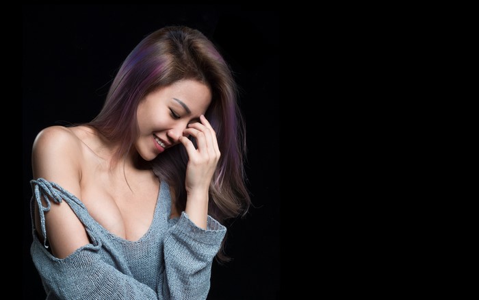4K Asian Woman Smiling in Sweater