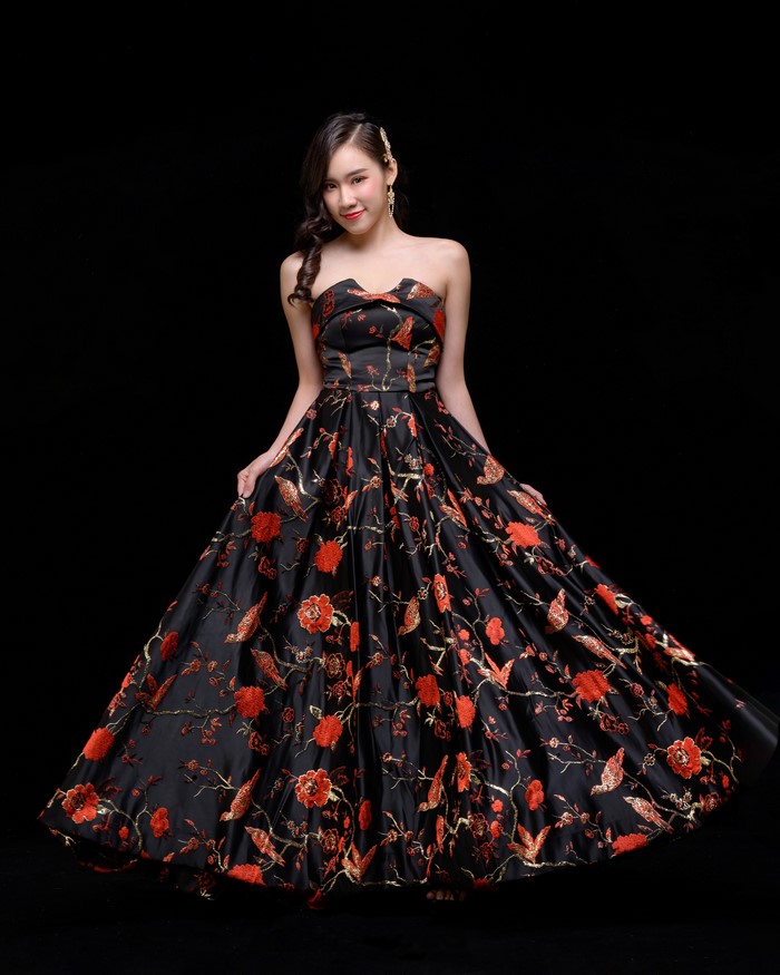 Asian woman in a black floral dress