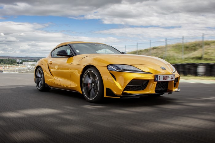 Yellow 2019 Toyota GR Supra A90 Coupe on Track