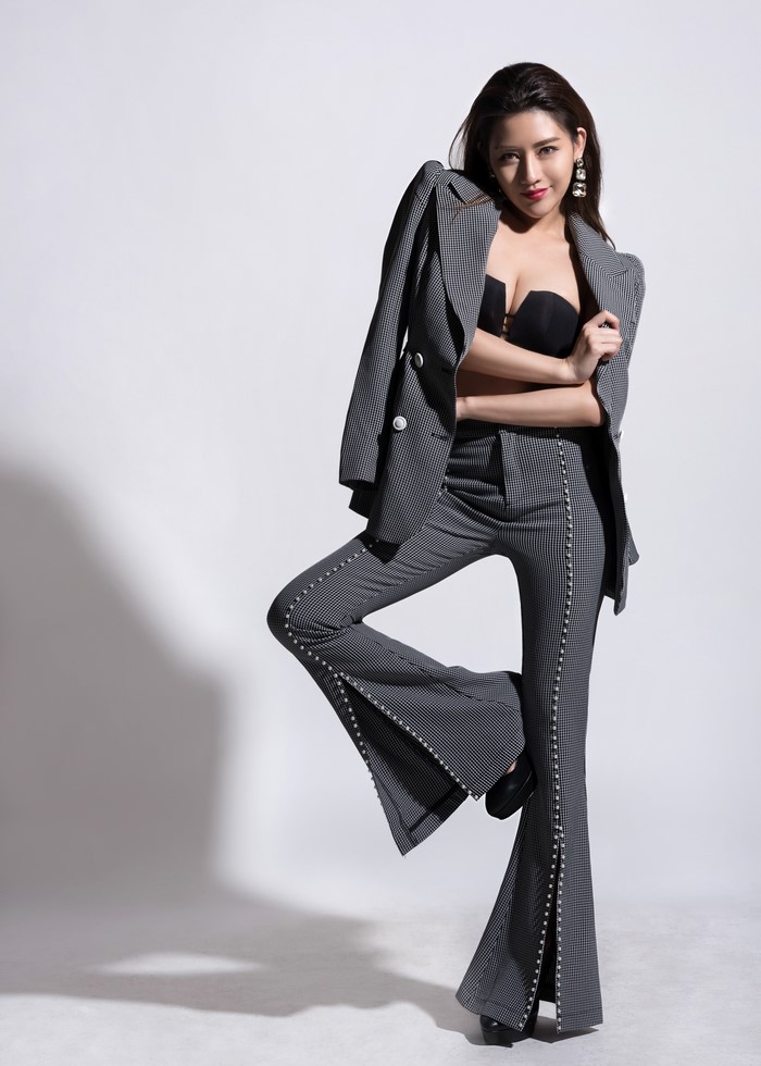 Brunette Woman in Stylish Suit Pose