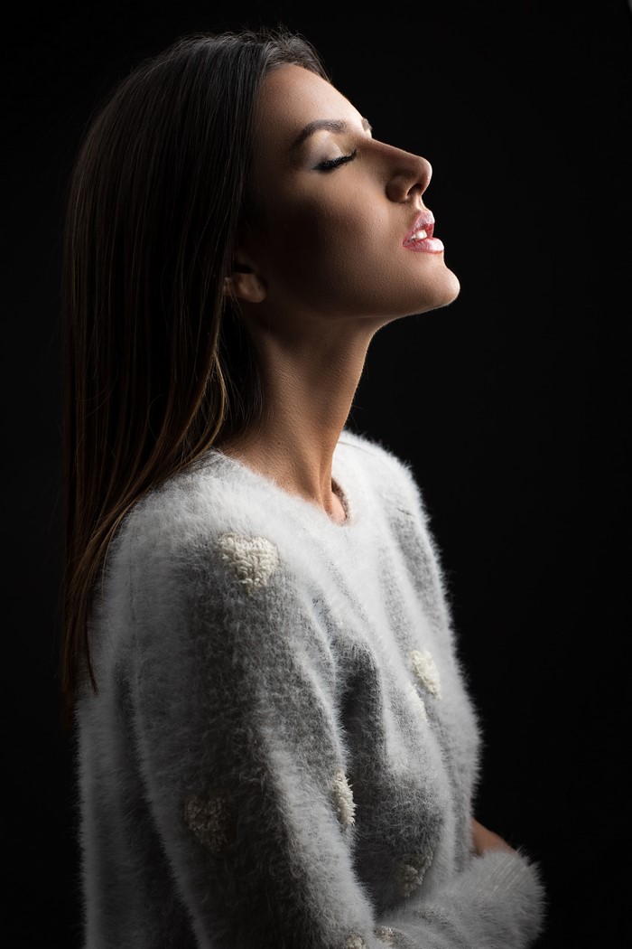 Tamara with brown hair wearing a sweater