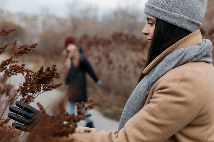 Brunette girl in winter hat and coat