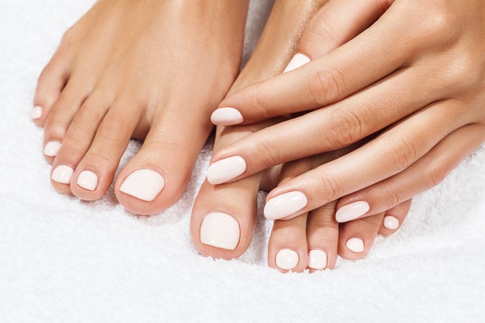 Manicure and Pedicure on White Background