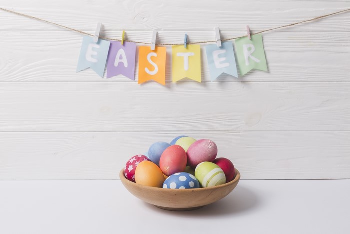 Easter eggs in a bowl with banner