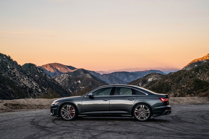 Audi S6 Sedan on a mountain road at sunset