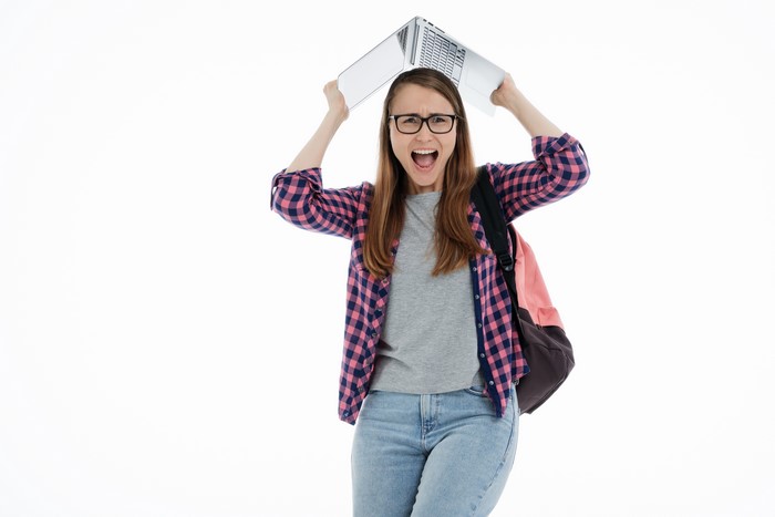 Student with laptop on white background