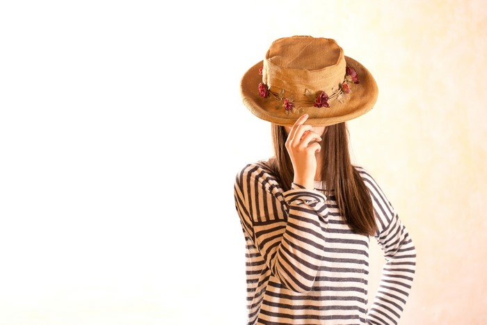 Woman in striped shirt wearing a hat