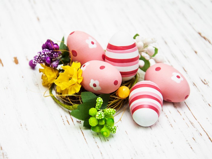 Easter eggs in a nest with flowers