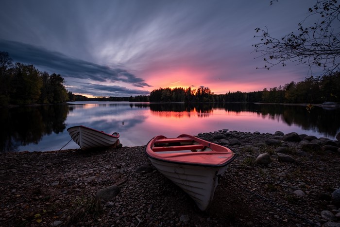 Boats on a lake at sunset in Sweden