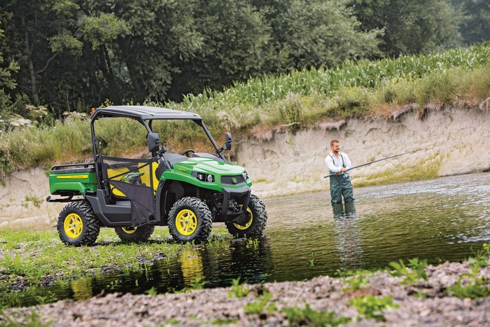 John Deere Gator XUV560 with man fishing