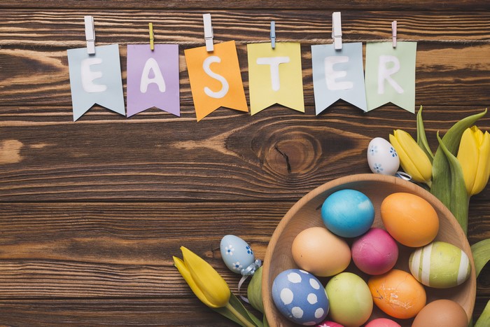 Easter banner with tulips and eggs on wood