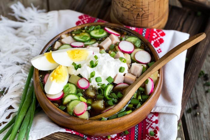 Okroshka soup with eggs, cucumbers, radishes, and sour cream
