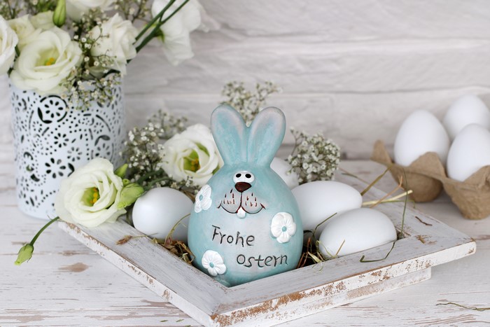 Easter bunny with flowers and eggs