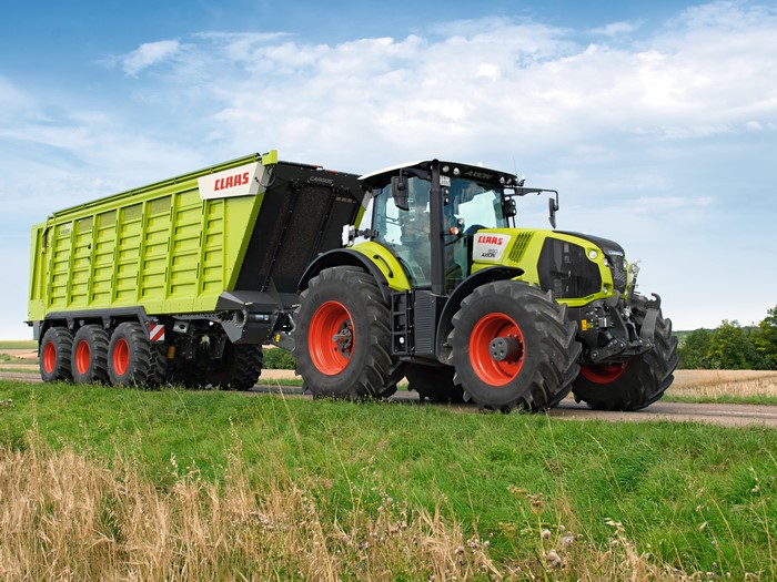 Claas Axion 850 tractor with trailer