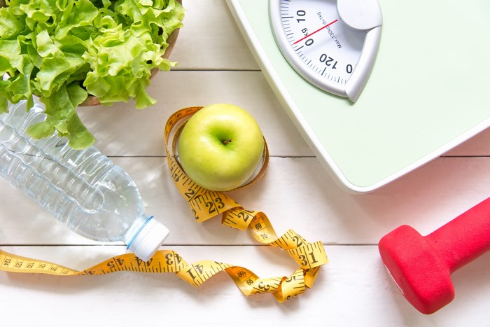 Apple, Water, Salad, Tape Measure, Dumbbell, and Scale