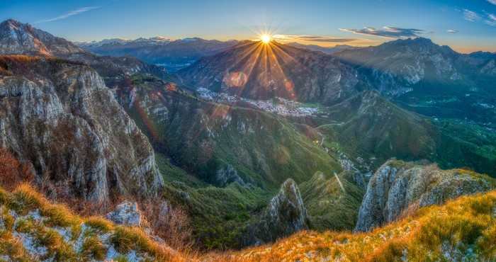 Sunrise over mountains with sun rays