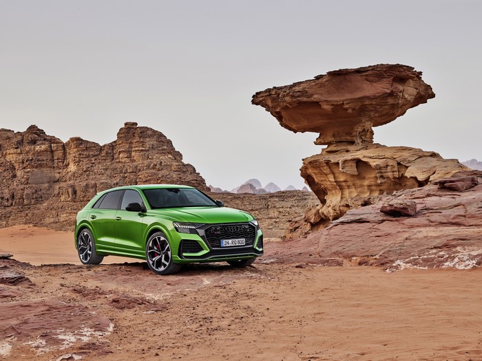 Green Audi RS Q8 in a desert landscape