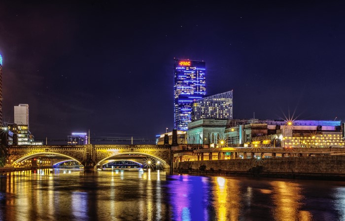 Philadelphia skyline with bridges and river at night
