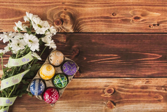 Easter eggs and Chrysanthemums on wood planks