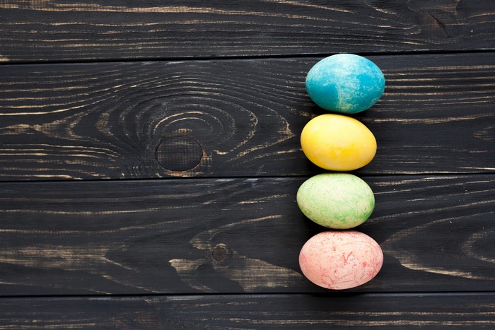 Easter eggs on dark wood planks