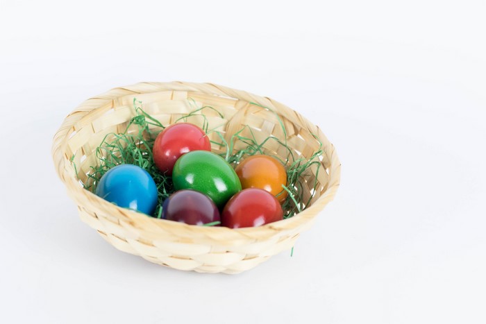 Multicolor Easter eggs in a wicker basket