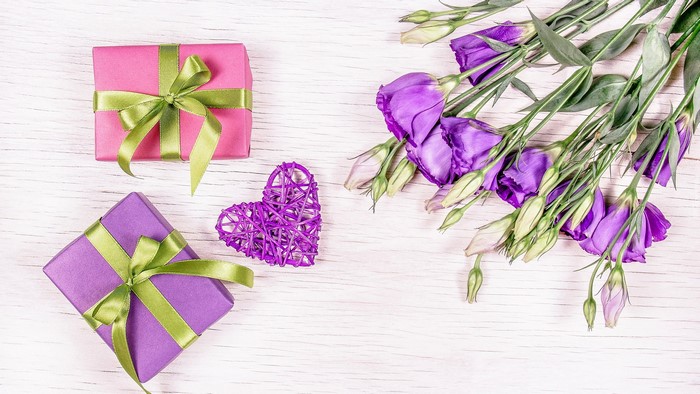 Purple and pink gifts with purple flowers and heart