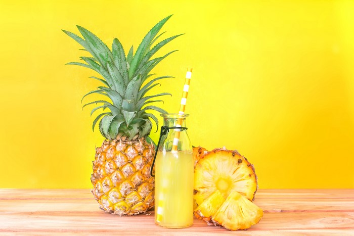 Pineapple Juice in a Bottle with Pineapples