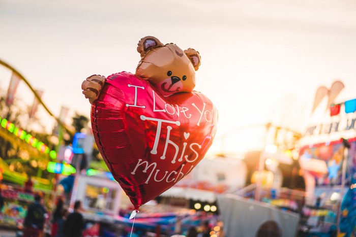 Red heart balloon with teddy bear and text