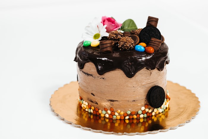 Chocolate cake with candies and flowers