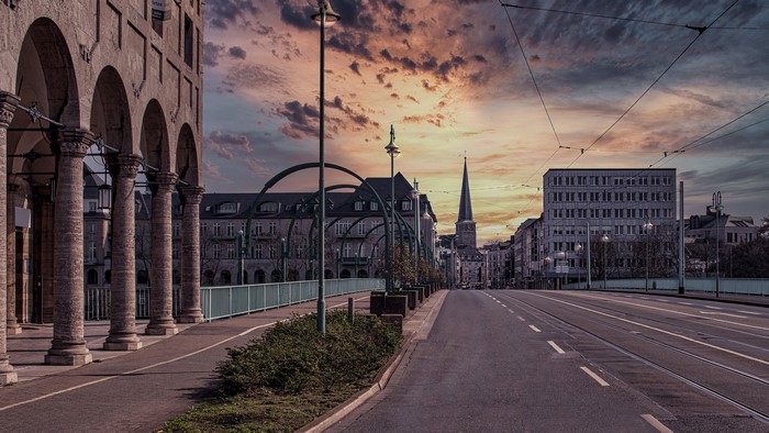 Street in Germany at Dusk with Arched Building