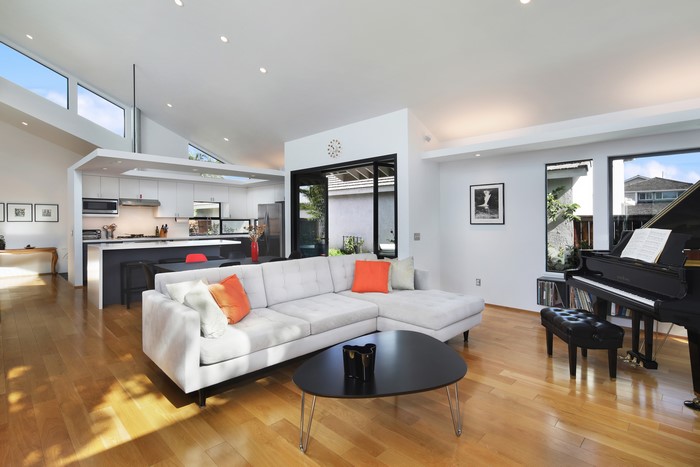 Living room with grand piano and sofa